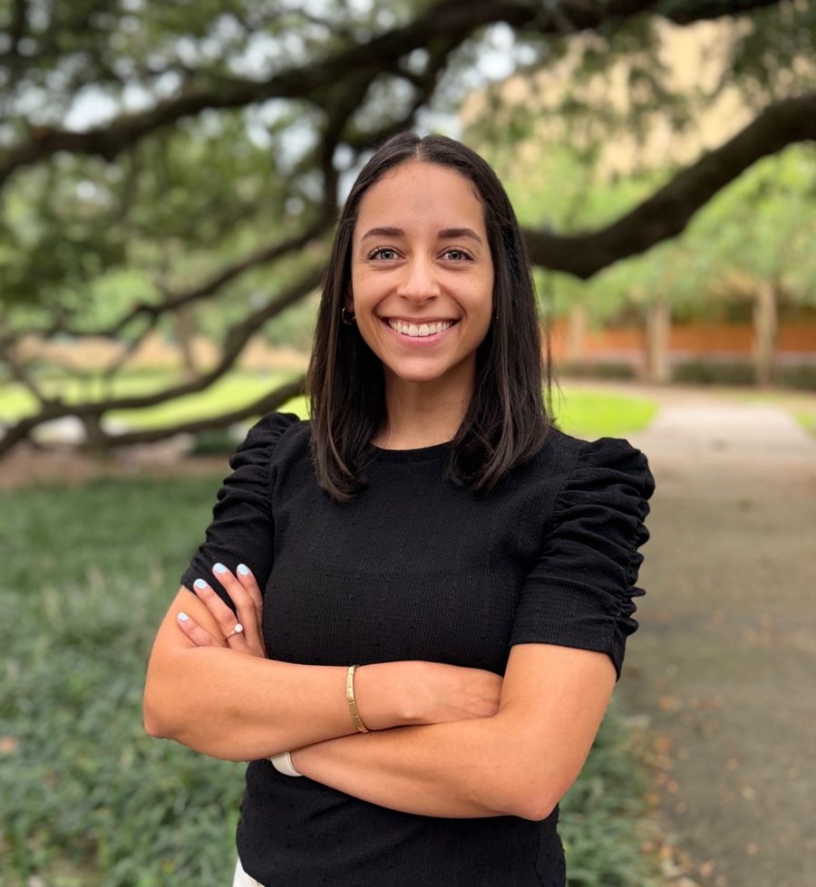 Anissa Janae Mimms, founder of HERD, smiling outdoors under an oak tree